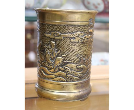 A Chinese 18th/19th Century cylindrical bronze brush pot, the frieze cast in relief with figures on a choppy sea, seal mark t