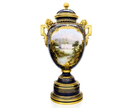 A Coalport Chatsworth House vase, the central image of Chatsworth painted by J H Plant, within a gilt blue ground, on pedesta