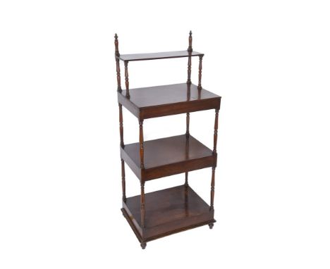 A George IV mahogany four tier whatnot, circa 1830, the top shelf set back, on turned baluster supports, 151cm high, 61cm wid
