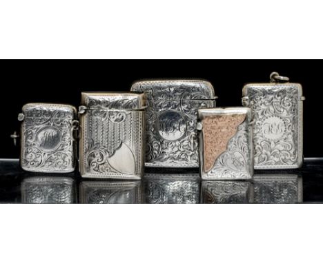 Five Edwardian silver vesta cases: the largest vesta case shaped square, the body and hinged cover profusely engraved with fo