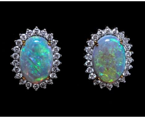 A pair of opal and diamond oval cluster stud earrings, the central black/grey opals measuring approximately 12mm by 8mm, pred