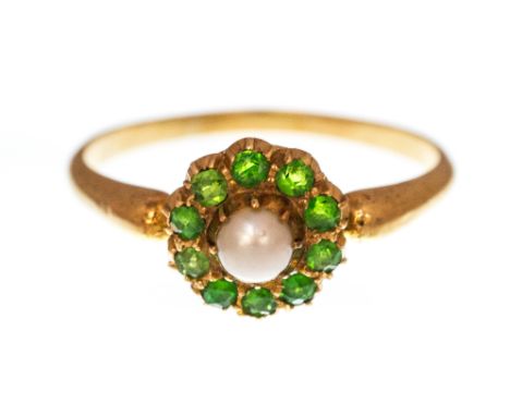 A Victorian pearl and green garnet cluster ring, the centre half pearl measuring approximately 4mm diameter to a surround of 