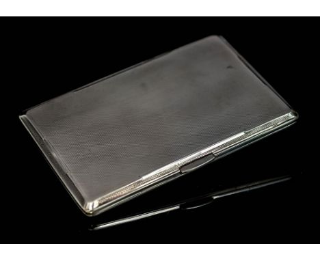 A George VI silver cigarette/cheroot case, rectangular the body with engine turned decoration with hinged thumbpiece, John Ro