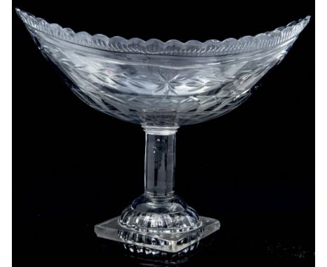 An 18th Century Irish canoe shaped clear cut glass table centrepiece, circa 1790, of boat shape, on 'lemon squeezer' foot, 30