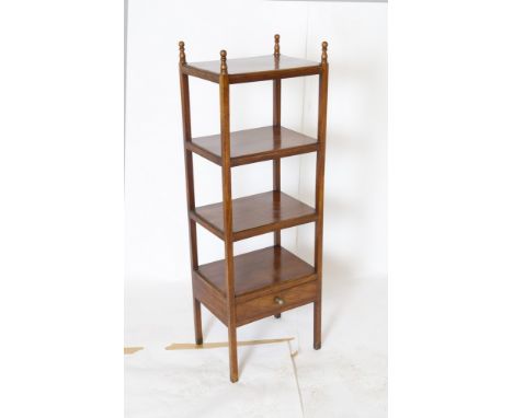 A George IV mahogany four tier whatnot circa 1820, the lower shelf with drawer below, 125cm high