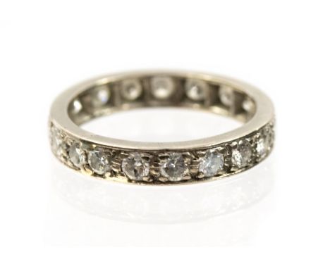 A diamond full eternity ring, nineteen round brilliant cut diamonds, total diamond weight approximately 1 carat, ring size K,