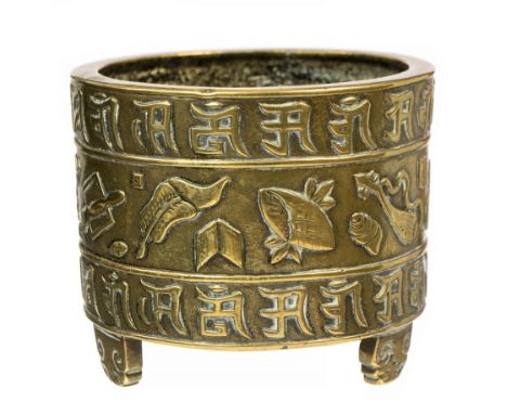 A 19th Century Chinese bronze tripod censor, cylindrical, cast in relief with a central frieze of scattered precious objects 