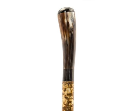 Ian Taylor, a fine hand crafted walking cane, in the form of an Ox Horn with a Buffalo Horn cap, complete with certificate of