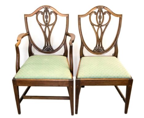 A set of six George III mahogany Hepplewhite design dining chairs, circa 1800, serpentine top rails, interlaced vase splats, 