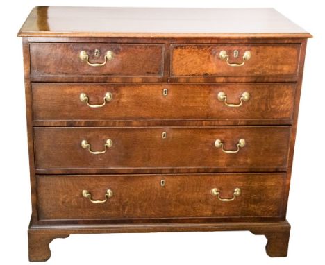 A George III country oak and mahogany crossbanded chest of drawers, circa 1770, moulded top, two short over three long drawer