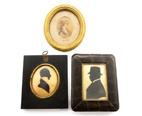Two 19th Century profile portrait silhouettes of gentlemen, one spectacled and wearing a hat, together with an oval watercolo