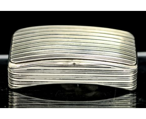 A George III silver snuff box, curved shaped rectangular the entire body chased with reeding, gilt interior with presentation