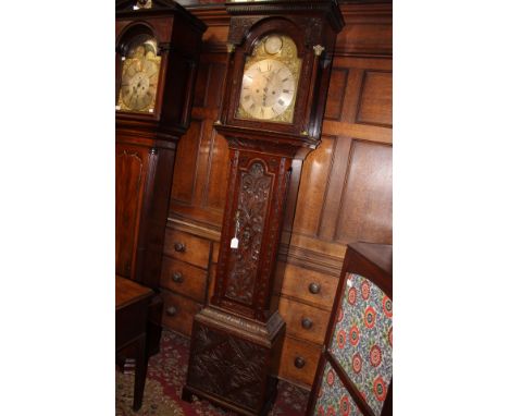 A George III oak longcase clock, having a carved case, the dial inscribed 'Blaylock Longtown', the dial with a silvered face 