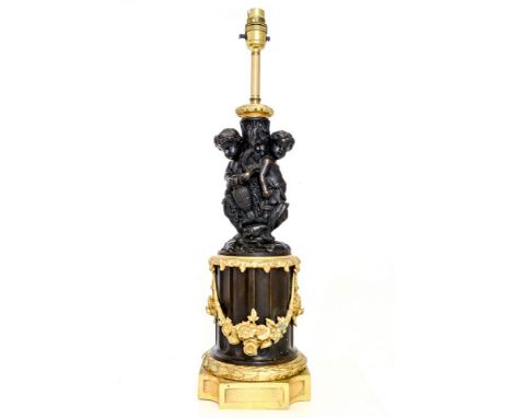 A French design decorative gilt metal and and bronzed table lamp base, modelled as cherubs on a plinth, height 54cm