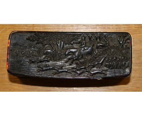 A 19th Century Canton/Chinese tortoiseshell table snuff box, the hinged cover carved in relief with a hunting scene in full s