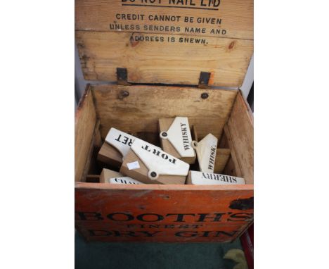A collection of Minton ceramic cellar labels including Claret, Whisky , Port, Sherry, Red Currant etc. in a Booths Dry Gin wo