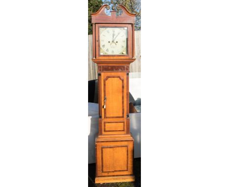 A George III oak and mahogany cross-banded eight day longcase clock, swan neck pediment, white painted dial, painted corners,