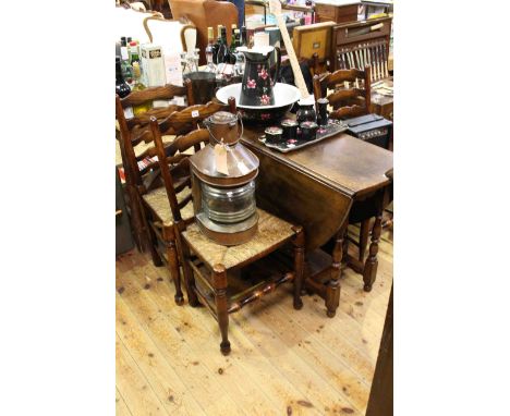 Oak gate leg dining table on turned legs and set of four rush seated ladder back dining chairs