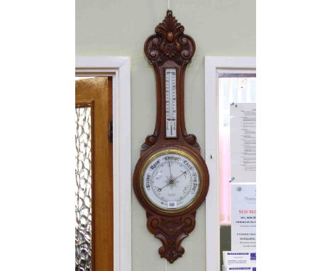 Carved oak aneroid barometer-thermometer
