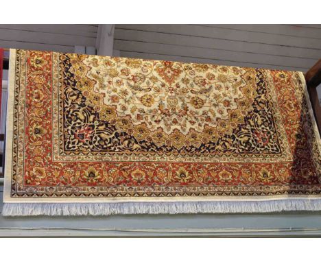 Keshan carpet with a beige ground 2.80 by 2.00