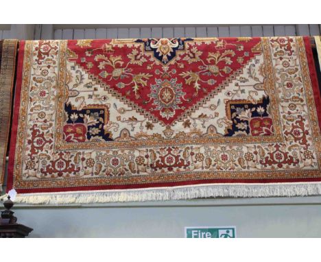 Heriz carpet with a red ground 2.80 by 2.00