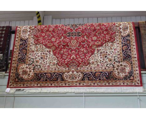 Keshan carpet with a red ground 2.80 by 2.00