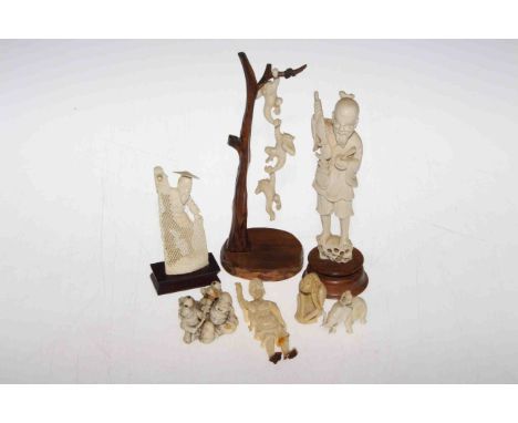 Group of carved ivories including netsuke, okimono, monkeys, etc., late 19th Century/ early 20th Century