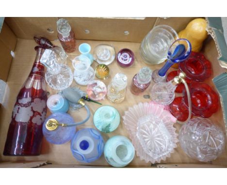 A collection of glass including perfume bottles, a flash cut ruby glass decanter, Russian doll, Caithness glass paperweight, 