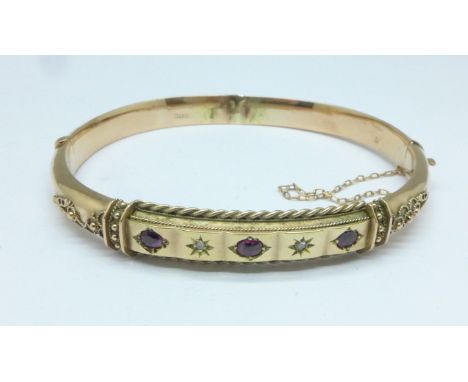 A 9ct gold, ruby and diamond bangle, 8.8g, a/f