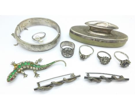 A silver bangle, a lizard brooch, other jewellery and a silver nail buff