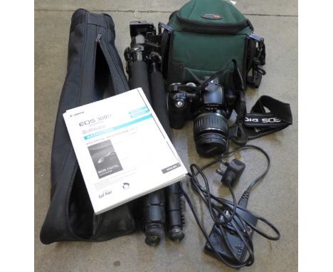 A Canon EOS 300D camera, with spare battery, case, tripod and charging unit