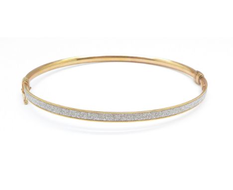 A 9ct gold and white stone bangle, 3.7g