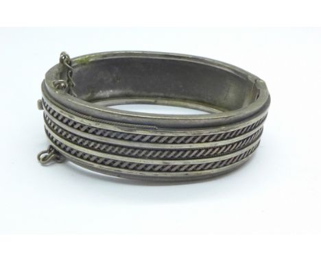 A Victorian white metal bangle, tests as silver, 33.9g