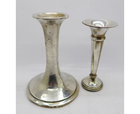 A silver posy vase and a silver candlestick, weighted