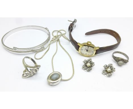 A silver bangle, silver and pearl earrings, two silver rings, a silver necklace and a Timex wristwatch