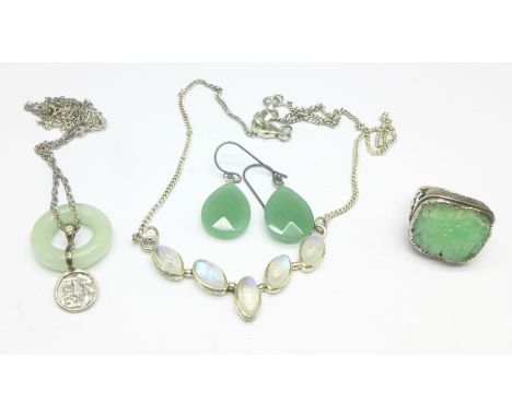 A silver and jade ring, a jade pendant, silver set earrings and a silver necklace