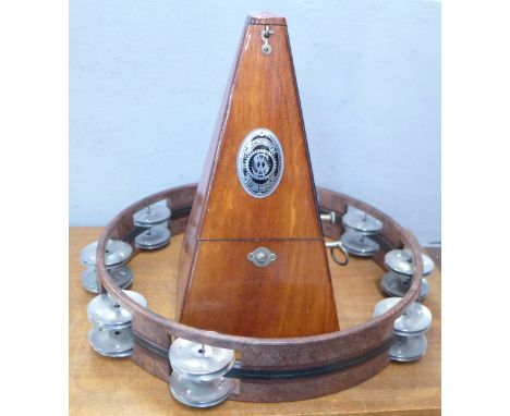 A System Maelzel metronome and a tambourine