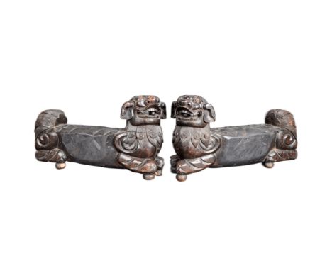 A large pair of 19th Century Chinese hand carved hardwood foo dogs / temple lions. Elongated form with carved facial features