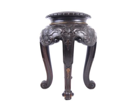 A 19th Century Chinese hand carved jardiniere planter vase stand. Circular form with hand carved details throughout depicting