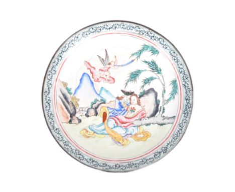 An early 20th century Chinese Canton enamel export plate. Depicting a colourful landscape scene with courting lovers and a fl