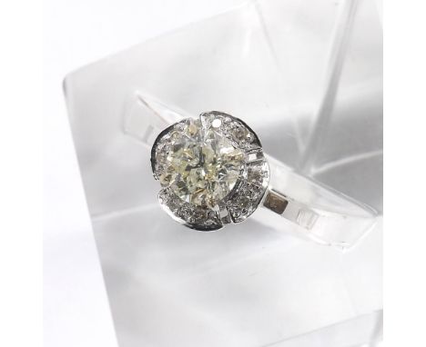 14k white gold solitaire diamond ring, round old-cut estimated 1.10ct approx, clarity I1/2, colour K-L, in a diamond petal ty