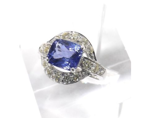 Impressive tanzanite and diamond 14k white gold dress ring, the cushion shaped tanzanite estimated 3.41ct, in a surround of r