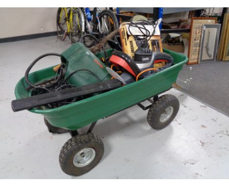A garden trolley of garden tools including hedge trimmer, hammer drill, cutters etc 