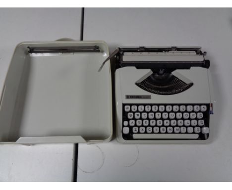A cased Hermes Baby typewriter 