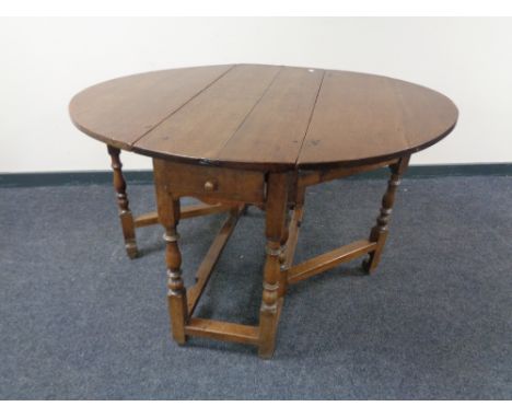 A Victorian oak gate leg table 