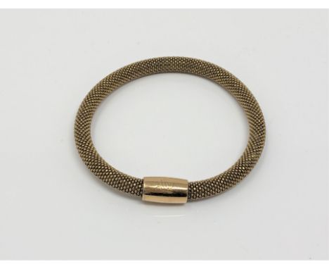 An Italian silver-gilt bangle.