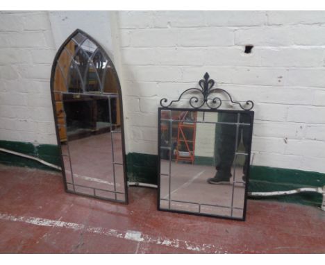 A metal framed leaded glass arch top mirror together with one other wrought iron framed leaded glass mirror 