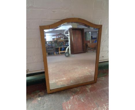 An early 20th century arch topped gilt framed bevelled edge mirror 