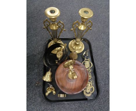 A tray of 20th century brass wares including pair of ornate candlesticks, horse brasses, ship's wheel nut cracker with bowl e