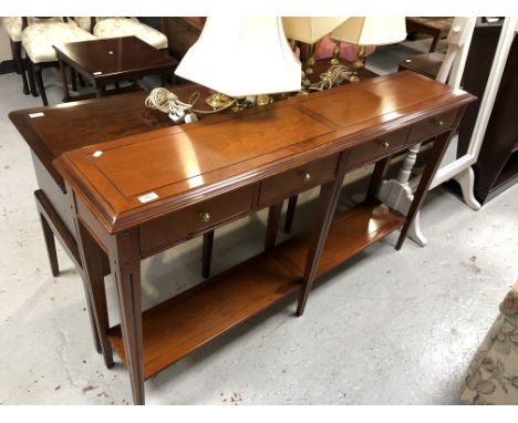 A Multiyork yew wood console table fitted four drawers, 148cm by 30cm by 81cm 